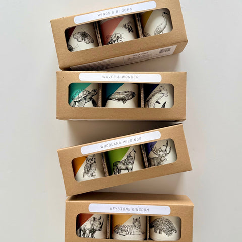 A variety of animal themed mini candle gift sets in a kraft box, featuring three 3.0 oz hand poured candles per set.
