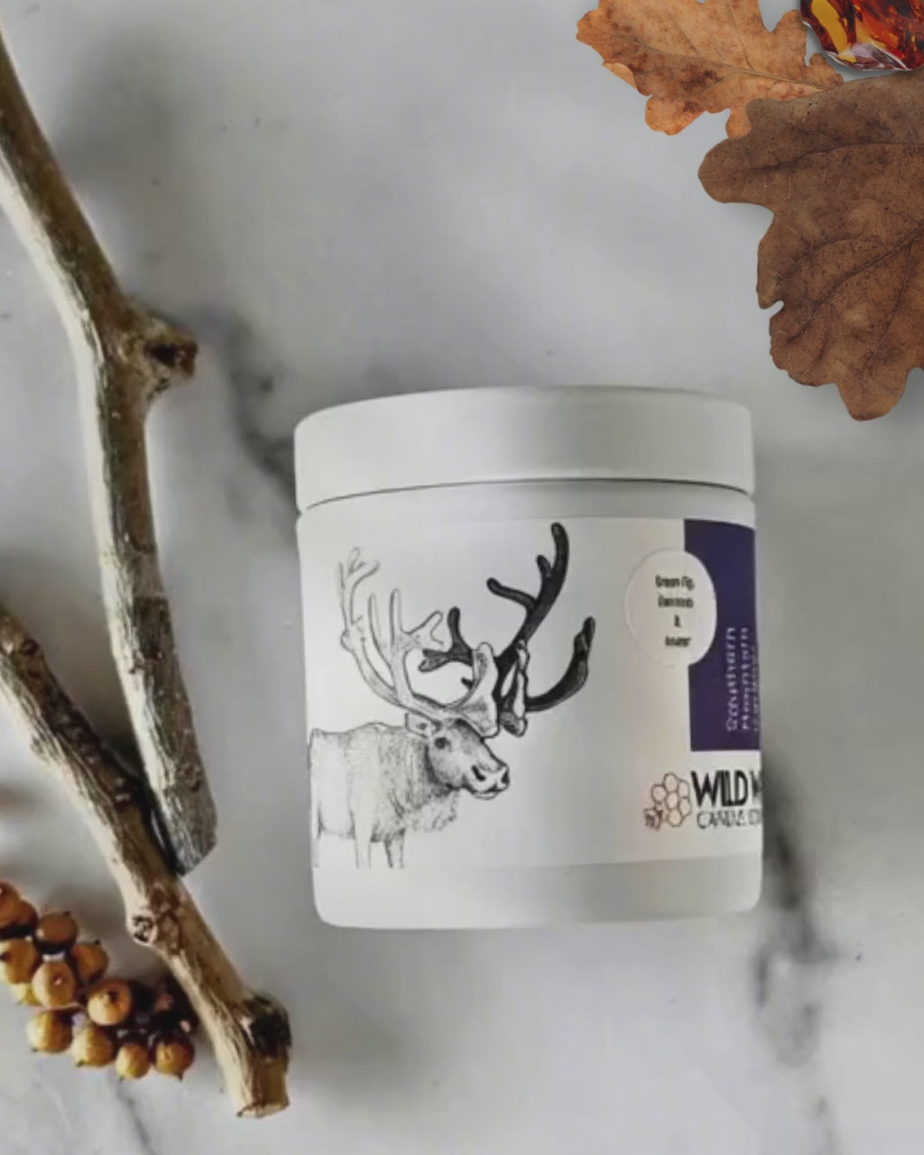 Stylized animation of caribou candle in bespoke green fig, oakmoss, and amber scent
