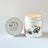 Candle with bumble bee design and a 'Wild Wax Candle Company' branded lid on a white background
