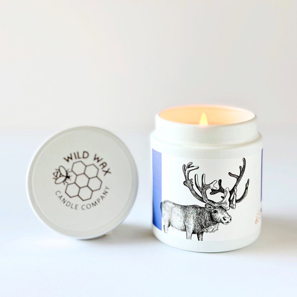 Wild Wax Candle Company candle featuring a caribou design with branded lid on a light background