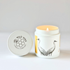 Hand-poured coconut wax candle scented with blood orange featuring a crane design
